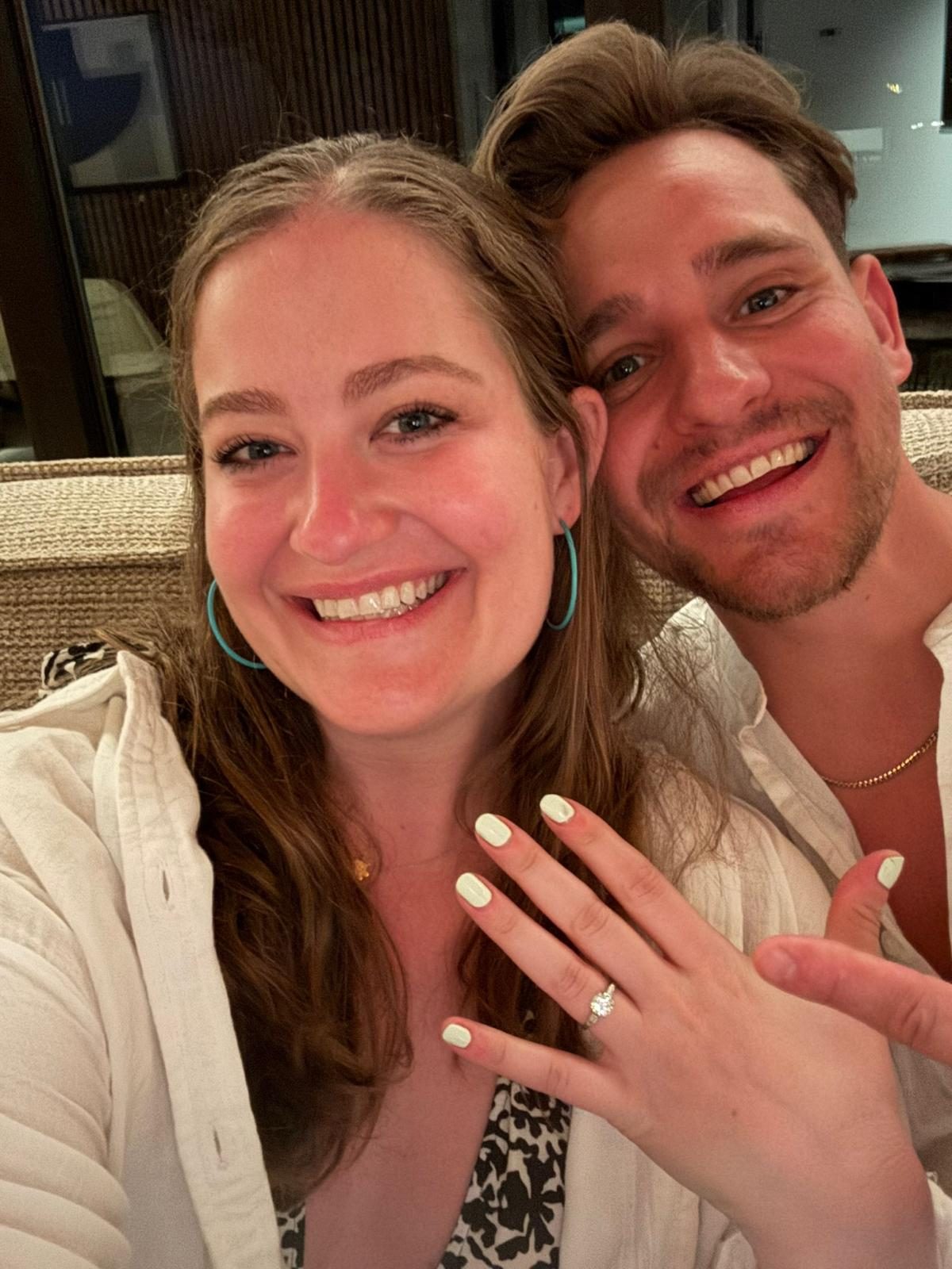 Shelby showing her engagement ring next to Andy